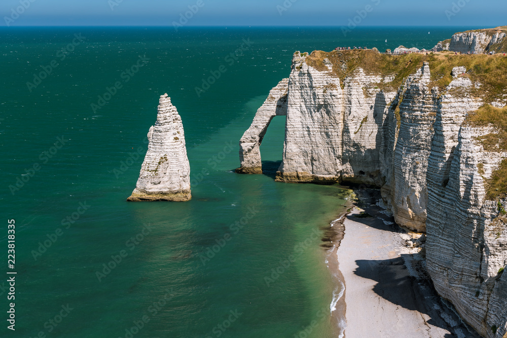 Fototapeta premium Chalk cliffs of Etretat with the natural arch Porte d'Aval and the stone needle called L'Aiguille