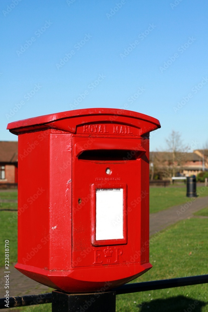 image of an old-fashioned red post in London town image of an old-fashioned red post in London town