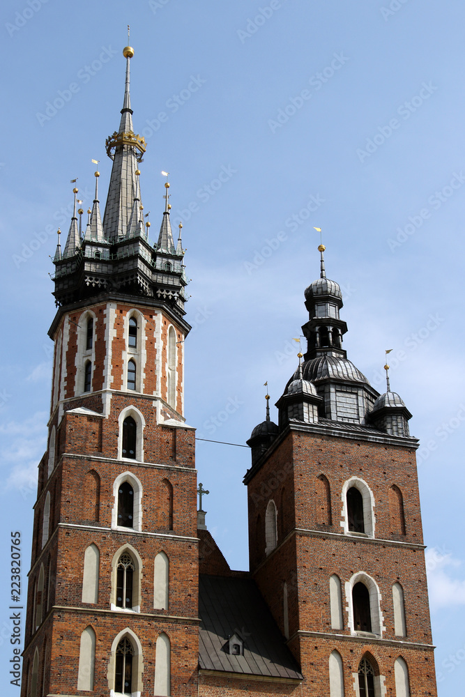 The view on beautiful medieval towers of St Mary's Basilica in day light, Krakow, Poland