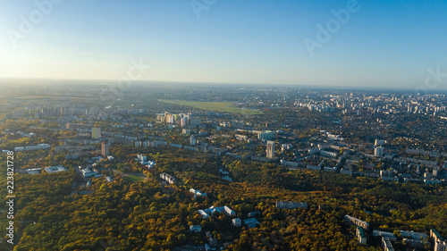 Golden autumn Kyiv cityscape, aerial drone view of city skyline and forest with yellow trees and beautiful landscape from above, Kiev, Goloseevo forest, Ukraine 
