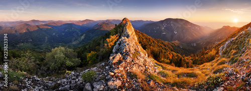 Rocky Panorama of sunset in mountain valley landscape.