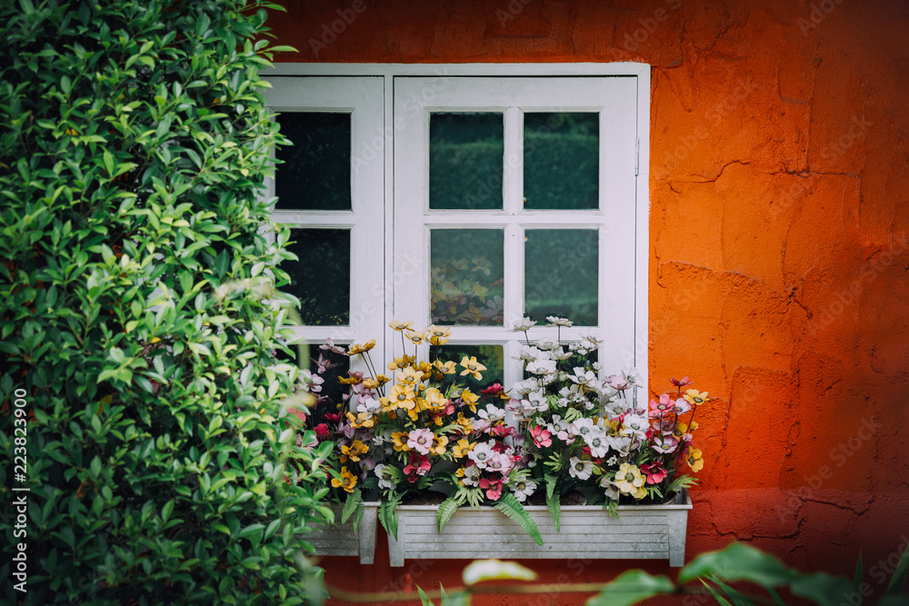 Window decorated with flowers in Vintage,right copy space.