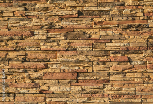 A brown brick wall (repeated background)