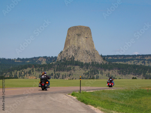 Bikers driving to Devils Tower National Monument at the Sturgis Motorcycle Rally in the Black Hills, Wyoming, USA