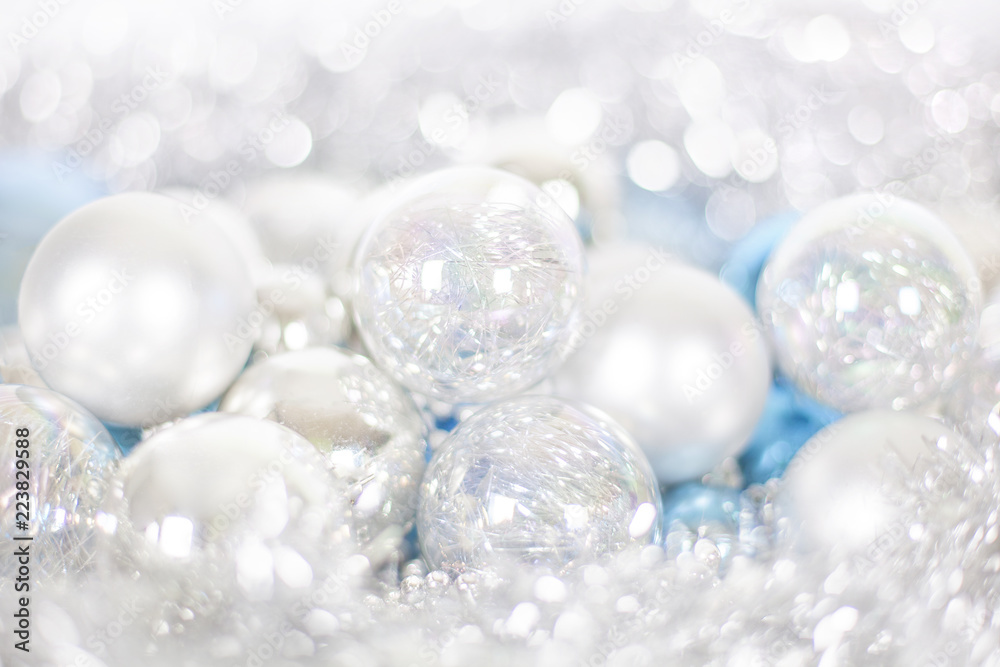 Christmas and New Year pattern, ornament of Christmas balls and tinsel, winter fairytale decor in blue and white color, lights bokeh closeup Christmas and New Year pattern, ornament of Christmas balls and tinsel, winter fairytale decor in blue and white color, lights bokeh closeup