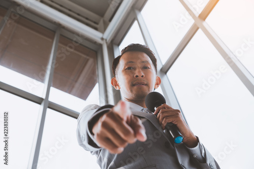 Asian Business men trainer giving presentation