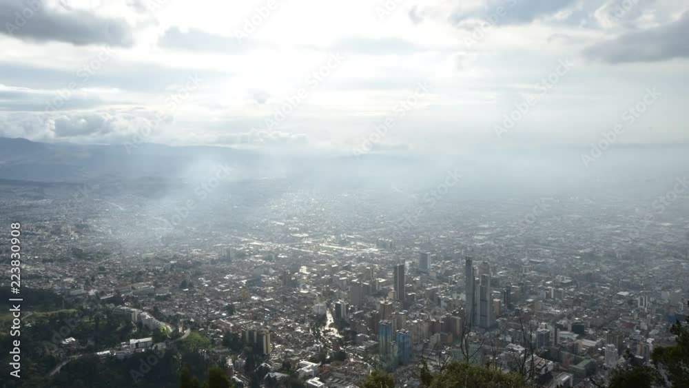 Time lapse of Bogota, Colombia at sunset as clouds and darkness envelop the city Time lapse of Bogota, Colombia at sunset as clouds and darkness envelop the city