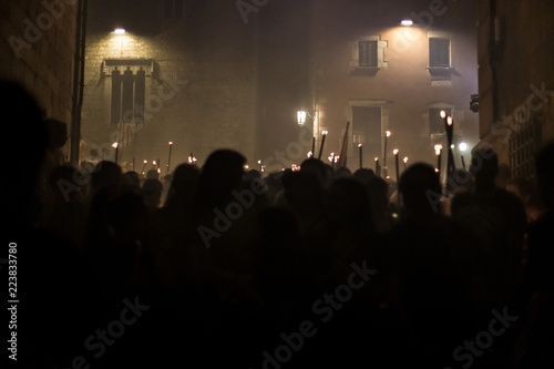 Dark torch parade outdoor on a night party in Girona