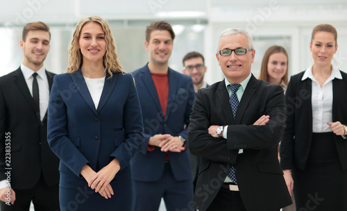 businessman and business woman standing in front of the business team.