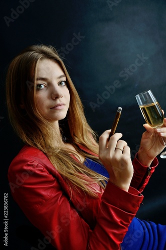 Young female with cigarillo and white wine photo