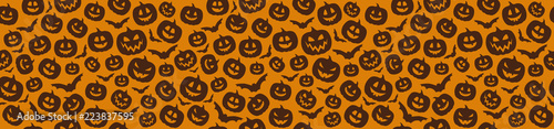 Seamless pattern with funny silhouettes of pumpkins. Vector.