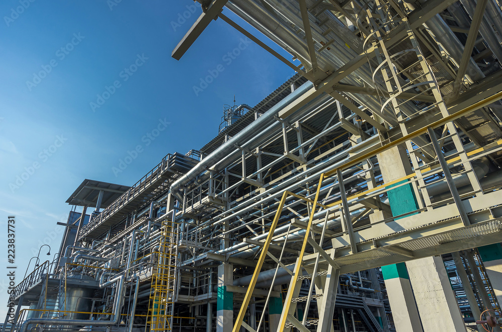 large and shiney, oil and gas pipes and pipelines inside chemical industry