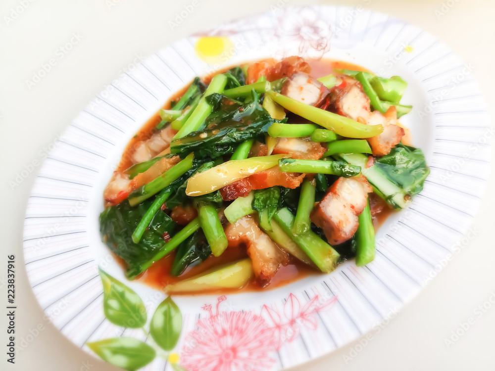 Stir fried kale with crispy pork / Thai Food is delicious Stir fried kale with crispy pork / Thai Food is delicious