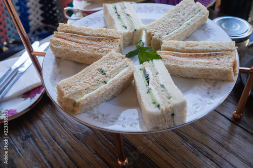 Variety of high tea sandwiches presented on a plate