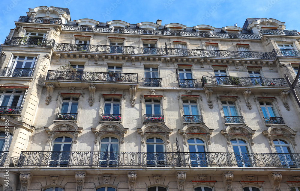 The traditional facade of Parisian building, France.