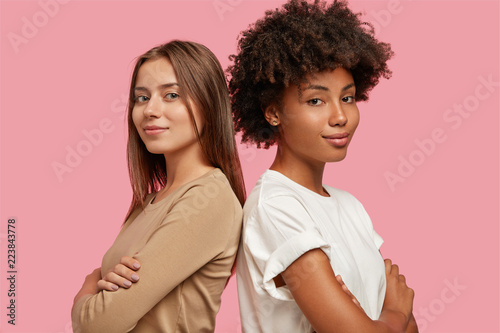 Diversity and feminity concept. Confident young mixed race women stand backs ...