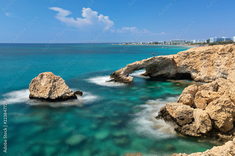 Long exposure shot of Love Bridge - picturesque natural formation creating a white-rock arch in Ayia Napa, Cyprus