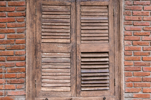 Old wooden door and brick wall