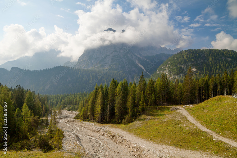 Dolomite Alps, river in the morning light, Belluno, Italy. Nearby Cortina d'Ampezzo. Dolomite Alps, river in the morning light, Belluno, Italy. Nearby Cortina d'Ampezzo.