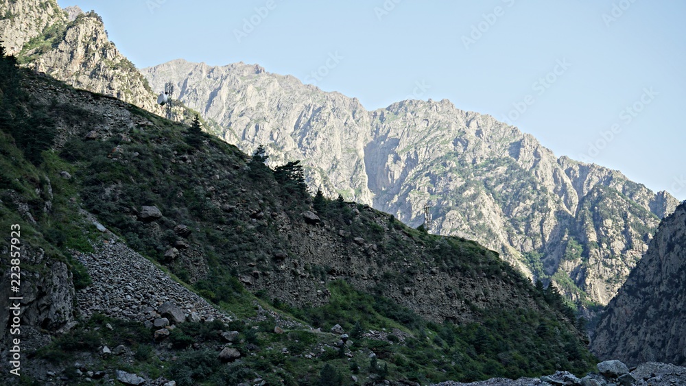 Fototapeta premium Mountain peak range landscape. Green mountain range view. Mountain peak blue sky white clouds panorama
