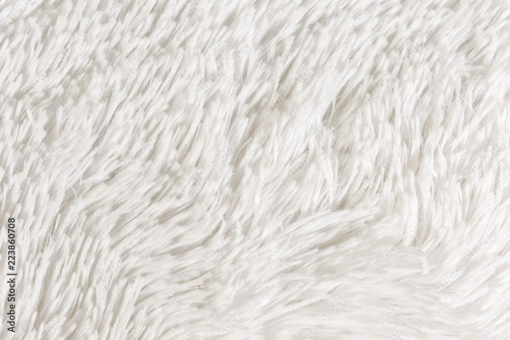 Fluffy plaid of polyester with a long heap gray. Comfortable home textiles. Background, texture Fluffy plaid of polyester with a long heap gray. Comfortable home textiles. Background, texture