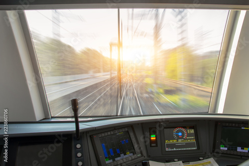 Driver's cab of aspeed passenger train, view of the railway with the effect of speed motion blur.