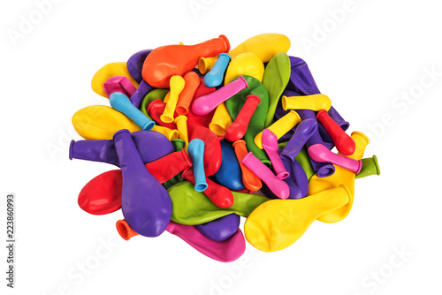Pile of multi-colored balloons on a white background.