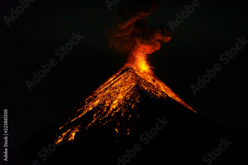 Lava going down the volcano Fuego in Antigua, Guatemala, right after an eruption by night. Natural background.