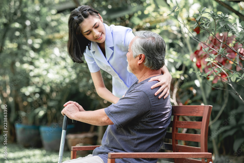 Nurse with patient sitting on bench together. Nurse with patient sitting on bench together.