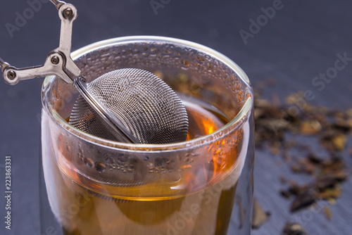 Double walled glass with tea and stainless steel tea infuser
