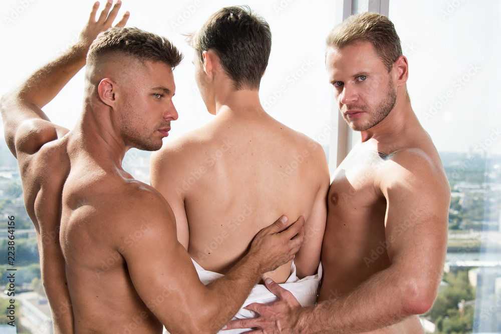 Three sexy guys. Gay family. фотография Stock | Adobe Stock