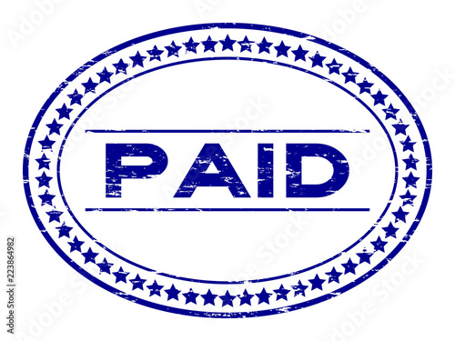 Grunge blue paid oval rubber seal stamp on white background
