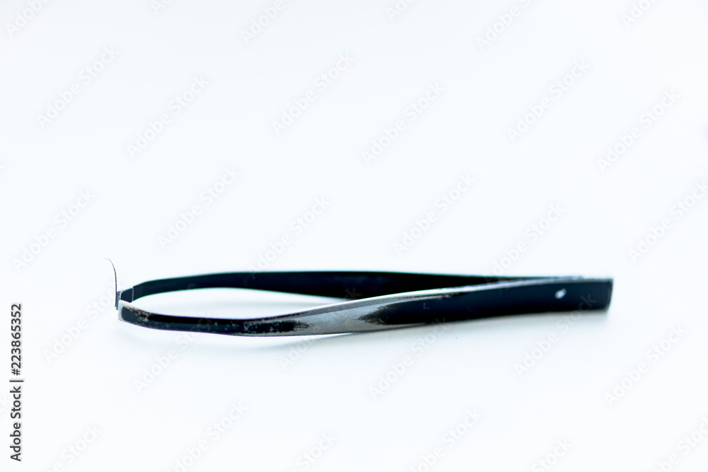 tweezers for plucking eyebrows. black on white background tweezers for plucking eyebrows. black on white background