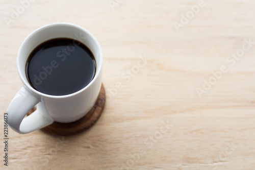 cup of coffee on wooden table