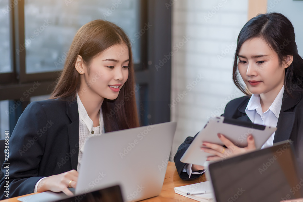 Group of businesswoman working in the office discussing documents and ideas at meeting Group of businesswoman working in the office discussing documents and ideas at meeting