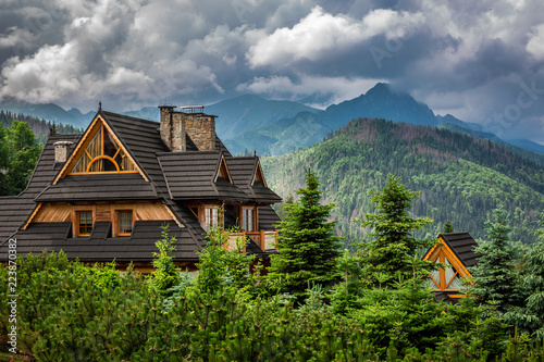 Clouds over Tatra Mountains and wooden cottage, Poland
