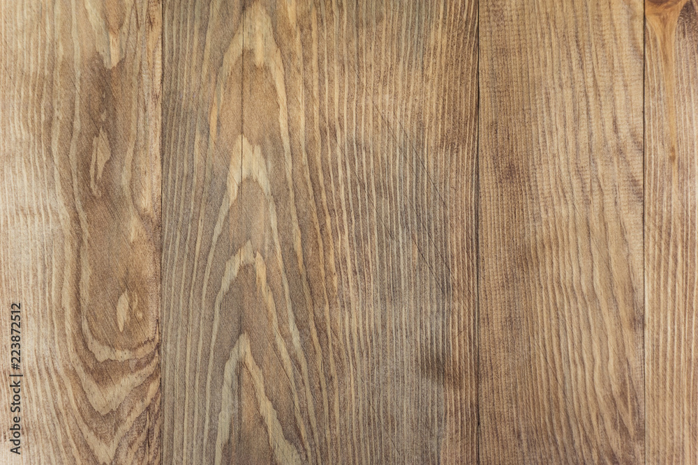 Brown wooden board with a pattern background texture, a wooden floor, a fence of natural wood, a surface of a teak wood background for design and decoration Brown wooden board with a pattern background texture, a wooden floor, a fence of natural wood, a surface of a teak wood background for design and decoration