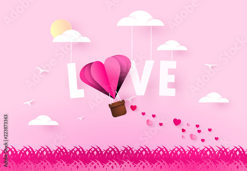 Love and valentines day.  Heart air balloon and word love on sky