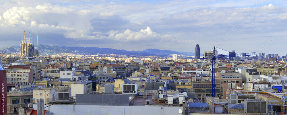 Fototapeta premium Rooftops and view of commercial and residential buildings in Barcelona Spain