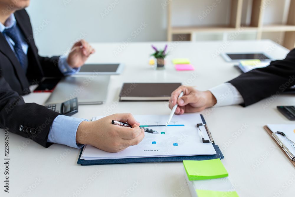 Group of business people meeting analyzing financial documents Group of business people meeting analyzing financial documents