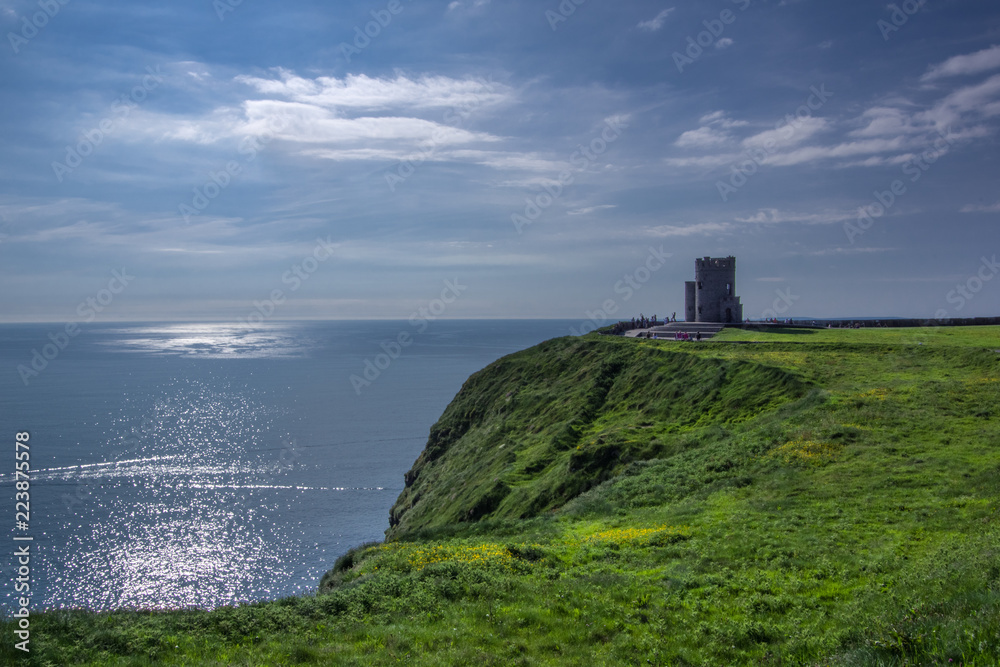 Landscape view of Cliffs of Moher and O'brien's tower with clear day sky. County Clare, Ireland.