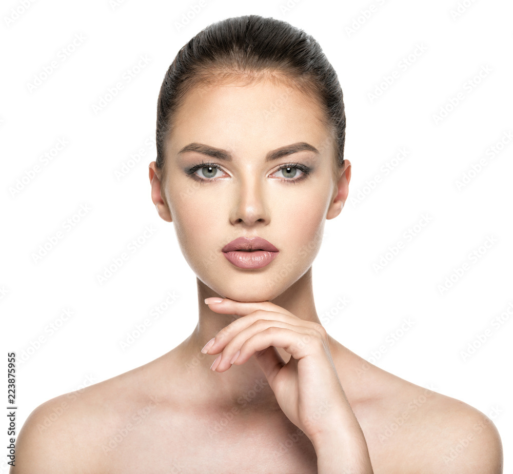 Beautiful woman cares for the skin face - isolated on white Beautiful woman cares for the skin face - isolated on white