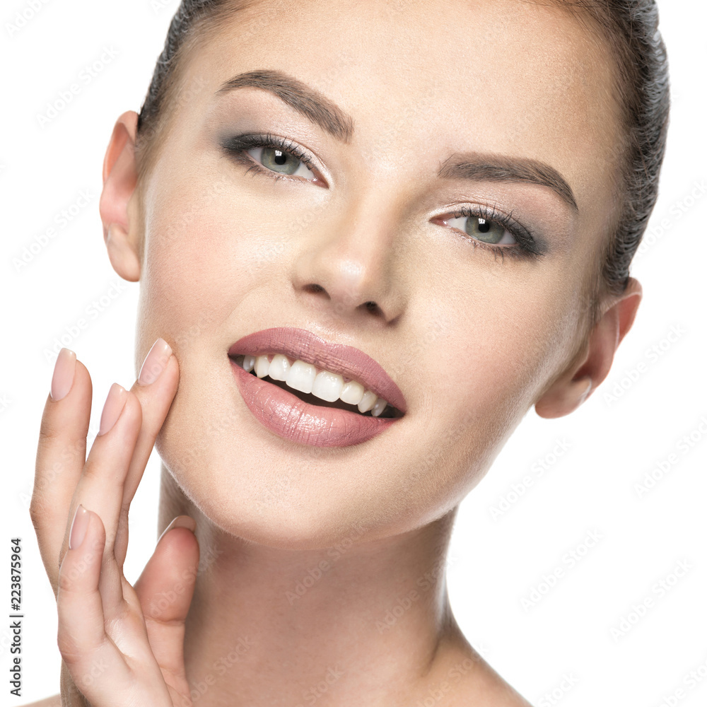 Beautiful woman cares for the skin face - isolated on white Beautiful woman cares for the skin face - isolated on white