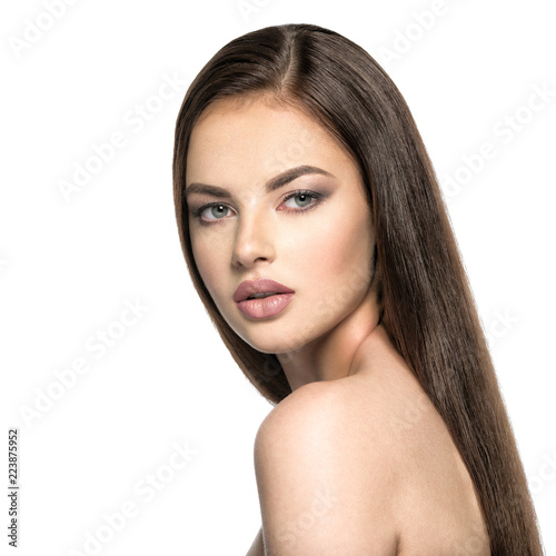 Face of the beautiful woman with long brown  hair
