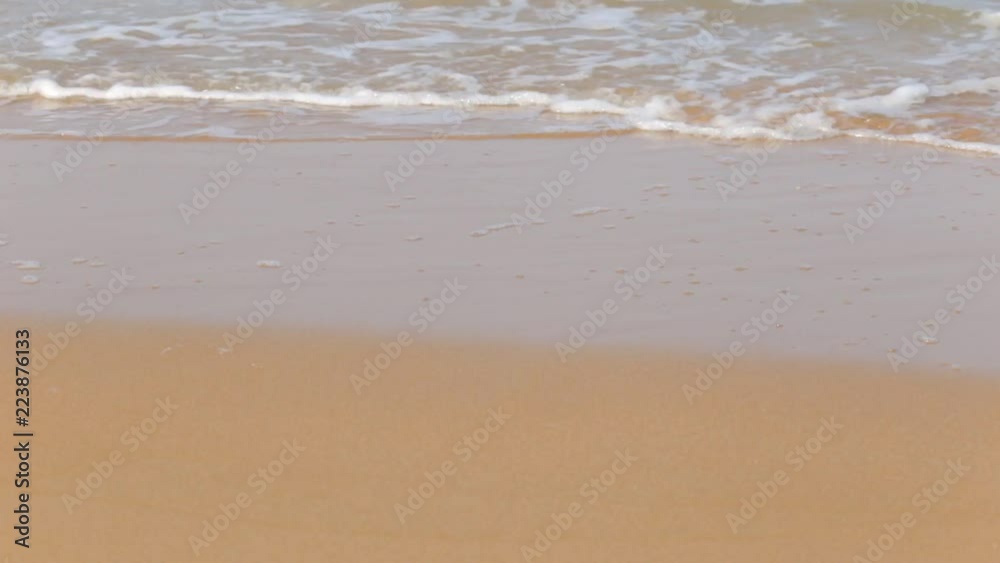 waves lapping on a sandy shore, no people, summer time waves lapping on a sandy shore, no people, summer time
