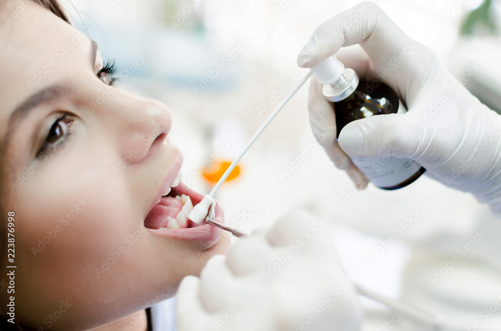 Dentist giving anesthesia to patient Dentist giving anesthesia to patient