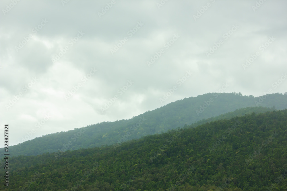 Landscape of sky and green mountain in rainy season at north Thailand.