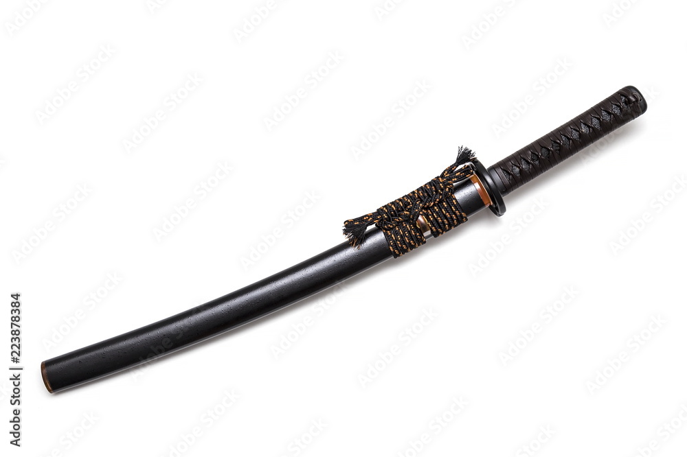 Brown leather cord tie on grip Japanese sword and black scabbard with steel fitting isolated in white background. Brown leather cord tie on grip Japanese sword and black scabbard with steel fitting isolated in white background.