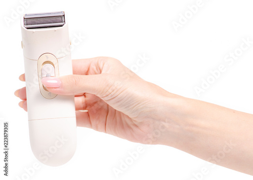 Foto Female electric shaver in a hand on a white background isolation