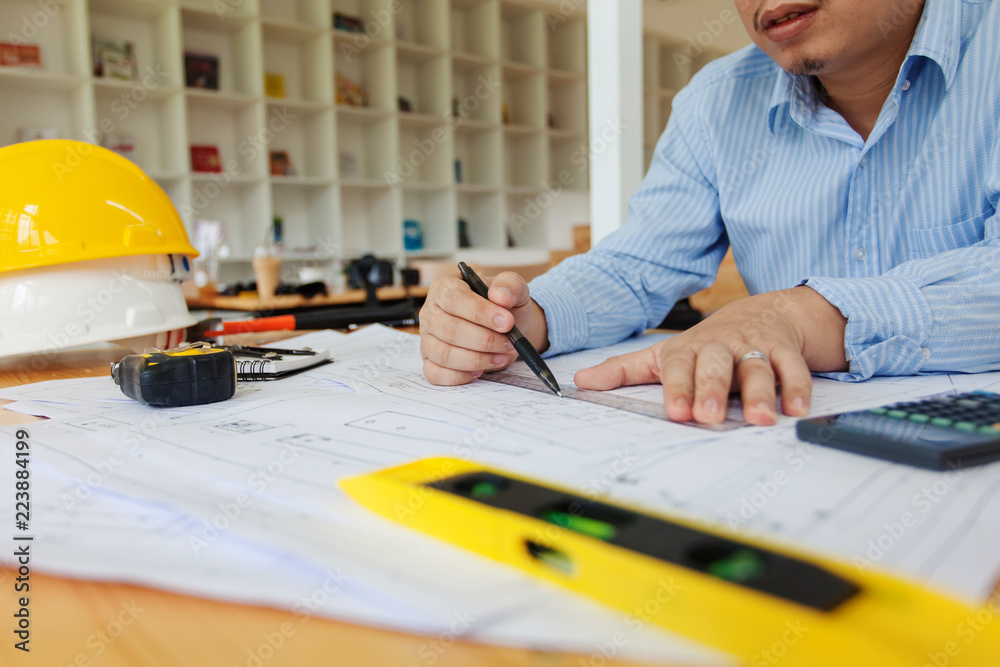 Engineer man working in the office, Drawing the construction project. Engineer man working in the office, Drawing the construction project.